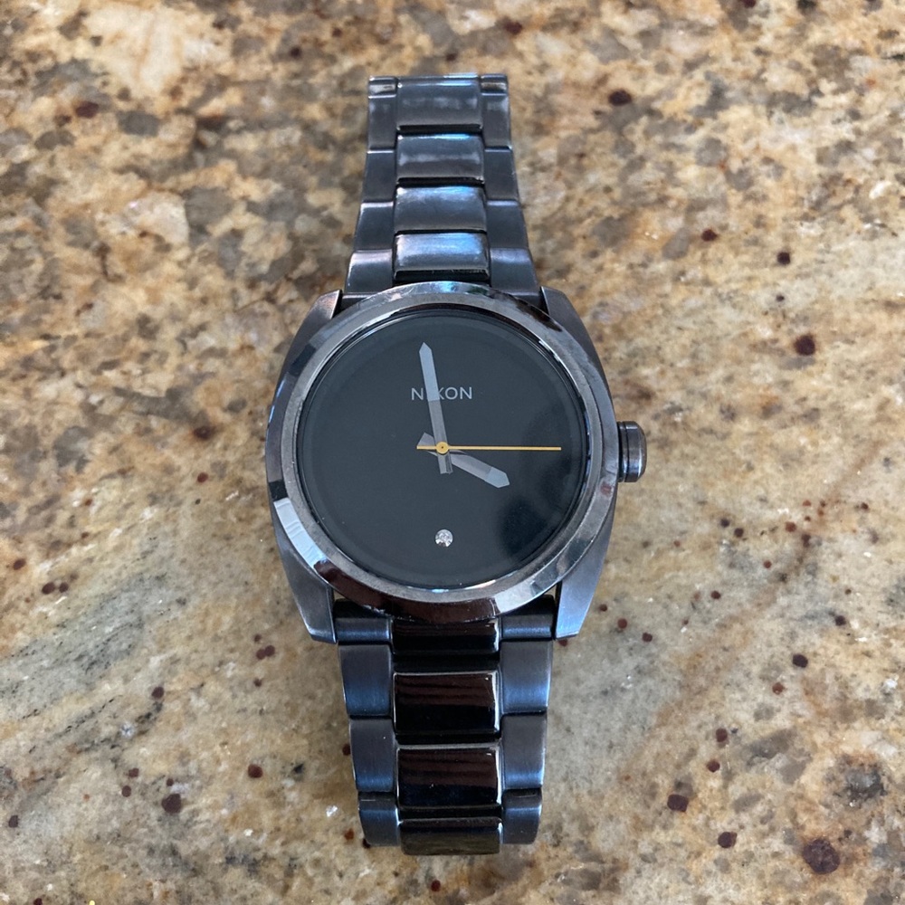 Nixon watch with tiny diamond